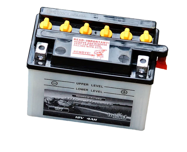 A small 12V 4AH lead-acid battery with visible cells and terminals.