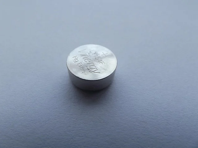 Battery management system: A single button cell battery with text 'Vinergy' and 'Hg Free'.
