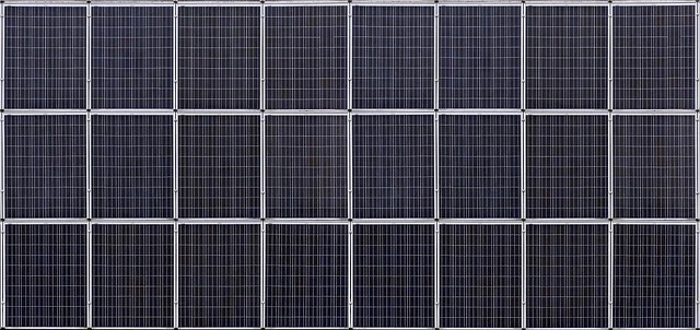 A grid of multiple solar panels, close-up view.