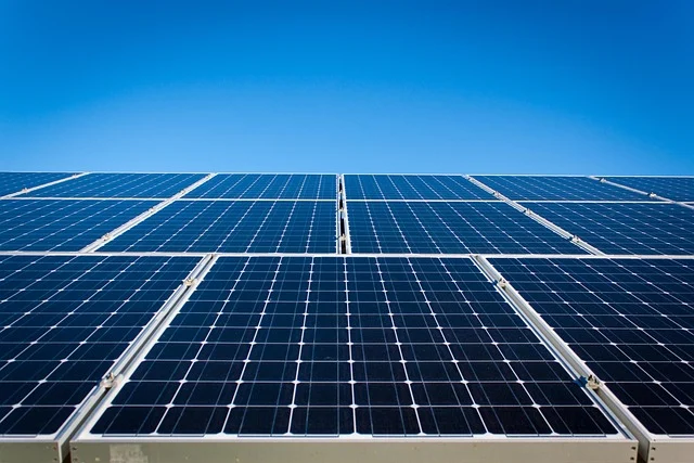 Solar panels under a clear blue sky.