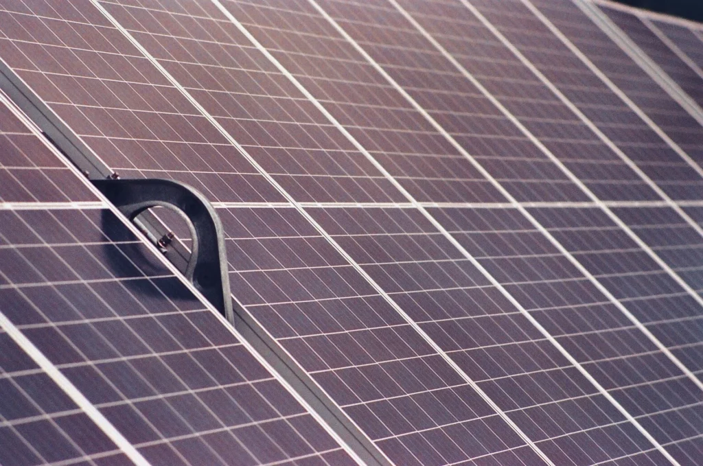Close-up of solar panels with mounting hardware visible.