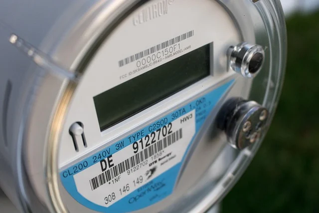 A close-up of an electricity meter with various labels and numbers.