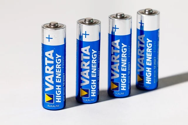 Lifepo4 vs agm: Four Varta High Energy AA alkaline batteries standing upright