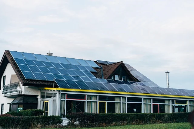 Are solar panels worth it 2026: Solar panels installed on the roof of a house and an adjacent building.