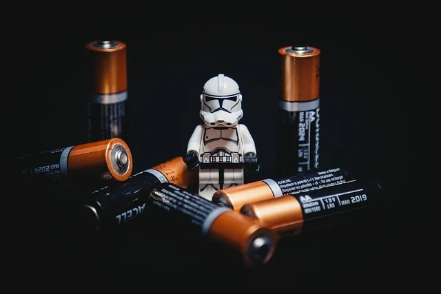 How to wire batteries in series and parallel: A Lego Stormtrooper surrounded by AA batteries.