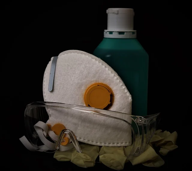 Safety equipment including a mask, goggles, gloves, and a bottle