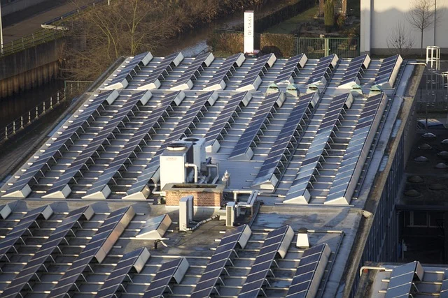Are solar panels worth it uk: Solar panels on a large rooftop, likely a commercial building