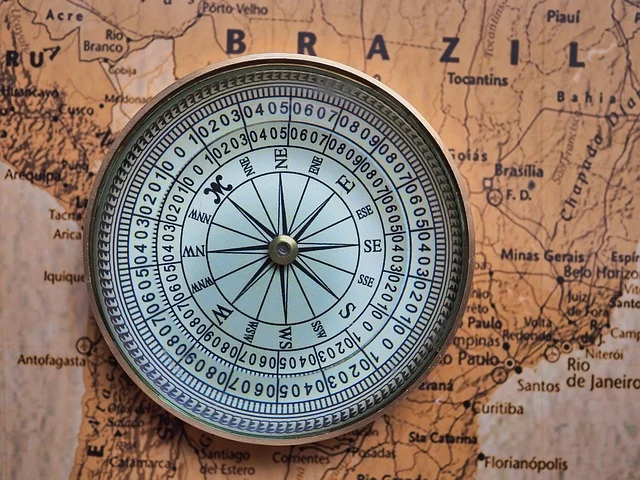 A compass on a map, indicating direction.