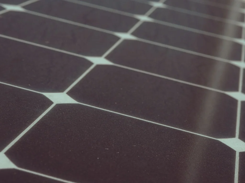 Close-up of solar panel cells, showing their grid pattern.