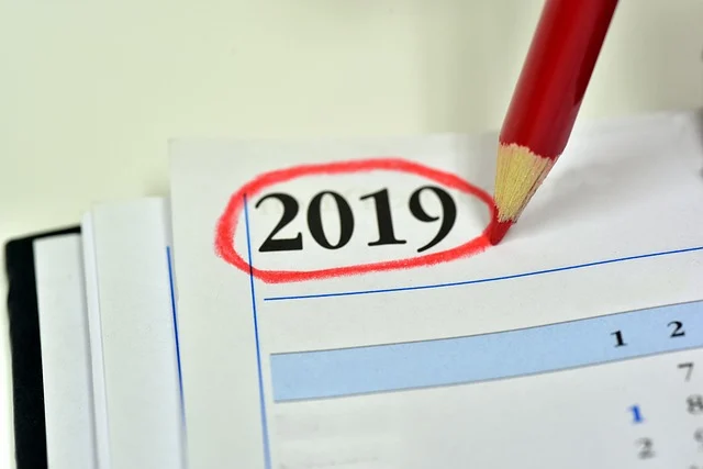 A red pencil circling the year 2019 on a calendar page.